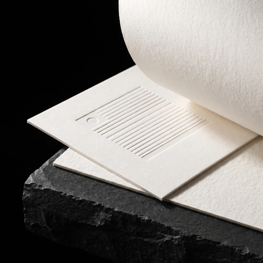 Crane Lettra cotton paper with a deep blind letterpress impression