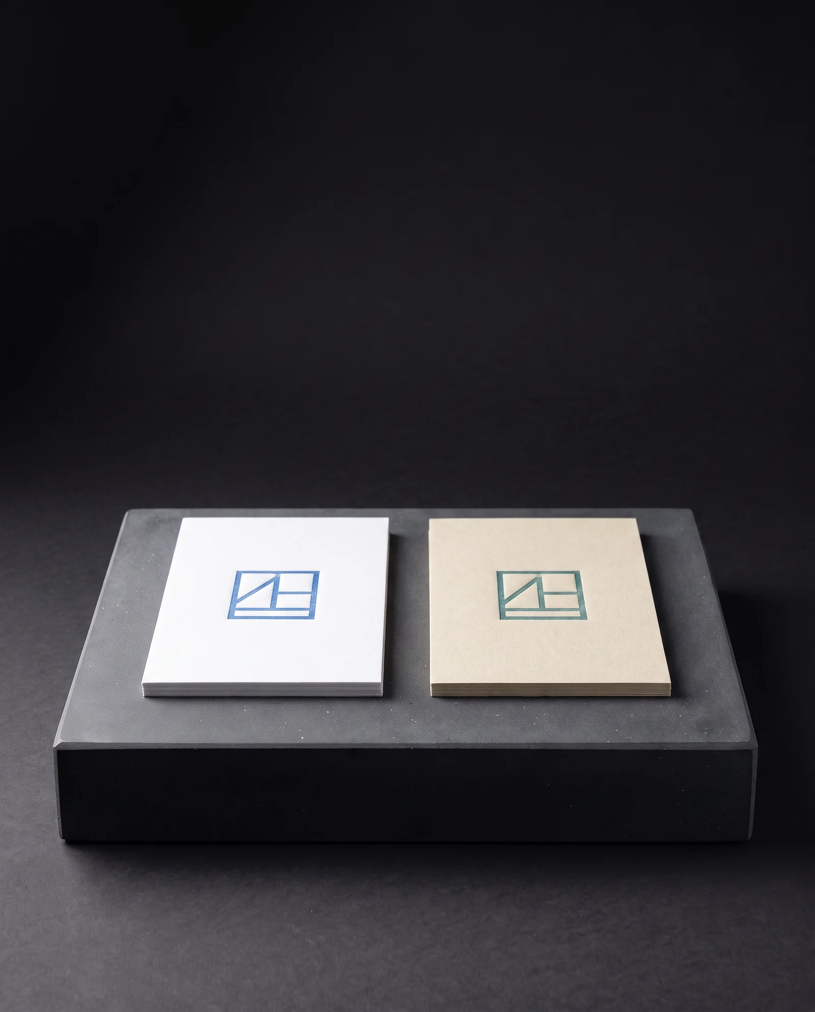 The same blue letterpress ink on white and on ecru cotton.