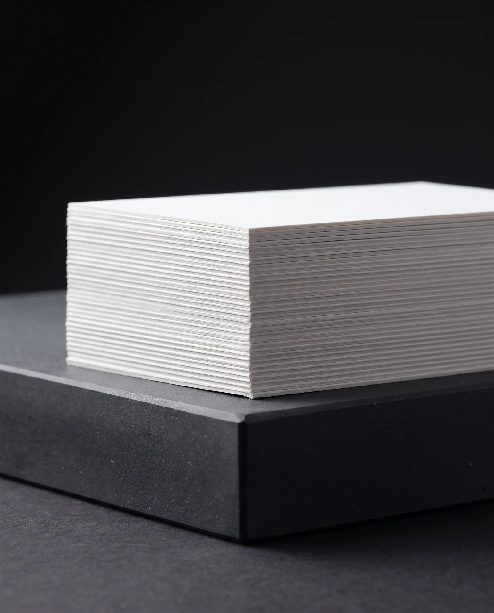 Clean cut edges of a stack of thick 48pt cotton cards.