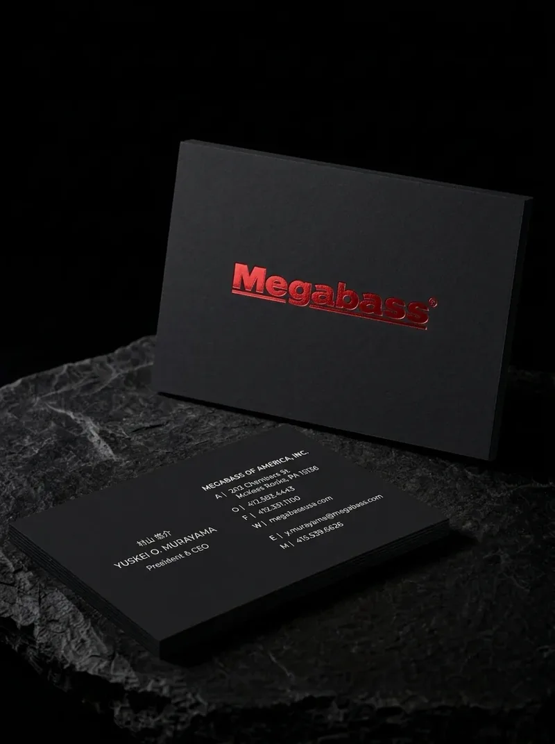 Black minimalist business card with a single red foil wordmark