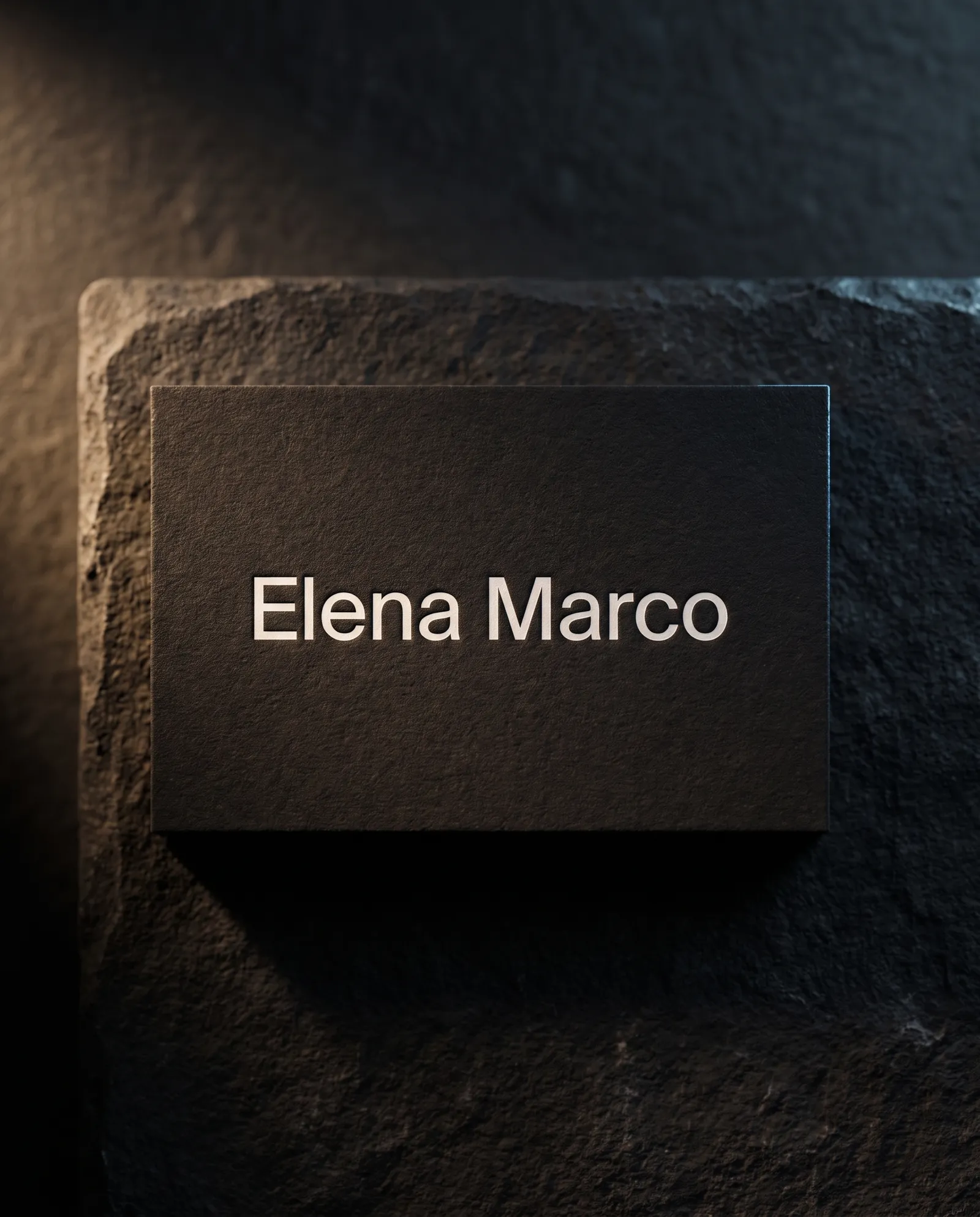 Design exploration: a modern black business card with a white pigment foil name