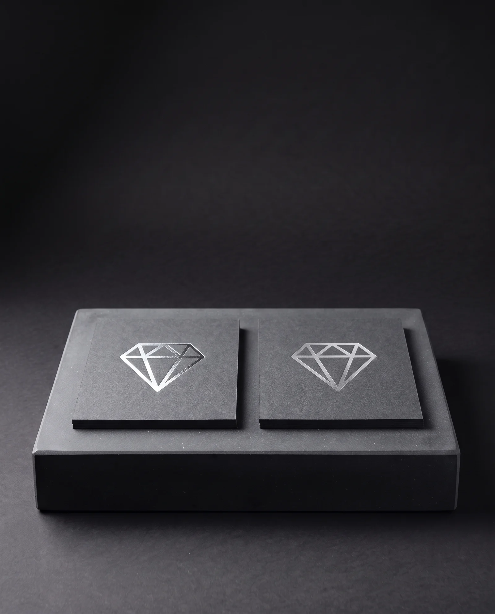 Mirror and satin silver foil on charcoal card.
