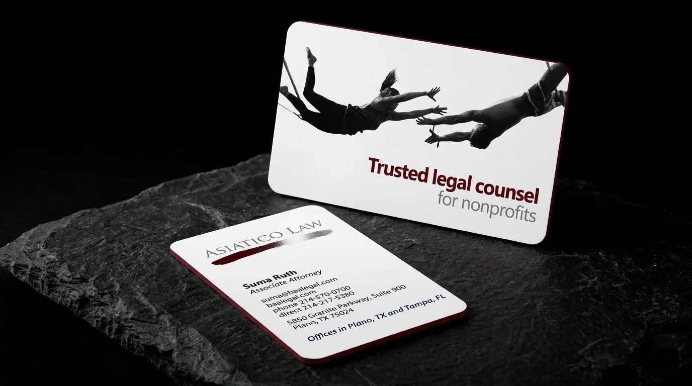 Asiatico Law business cards: white stock with rounded corners, a deep red painted edge and silver foil, on black stone