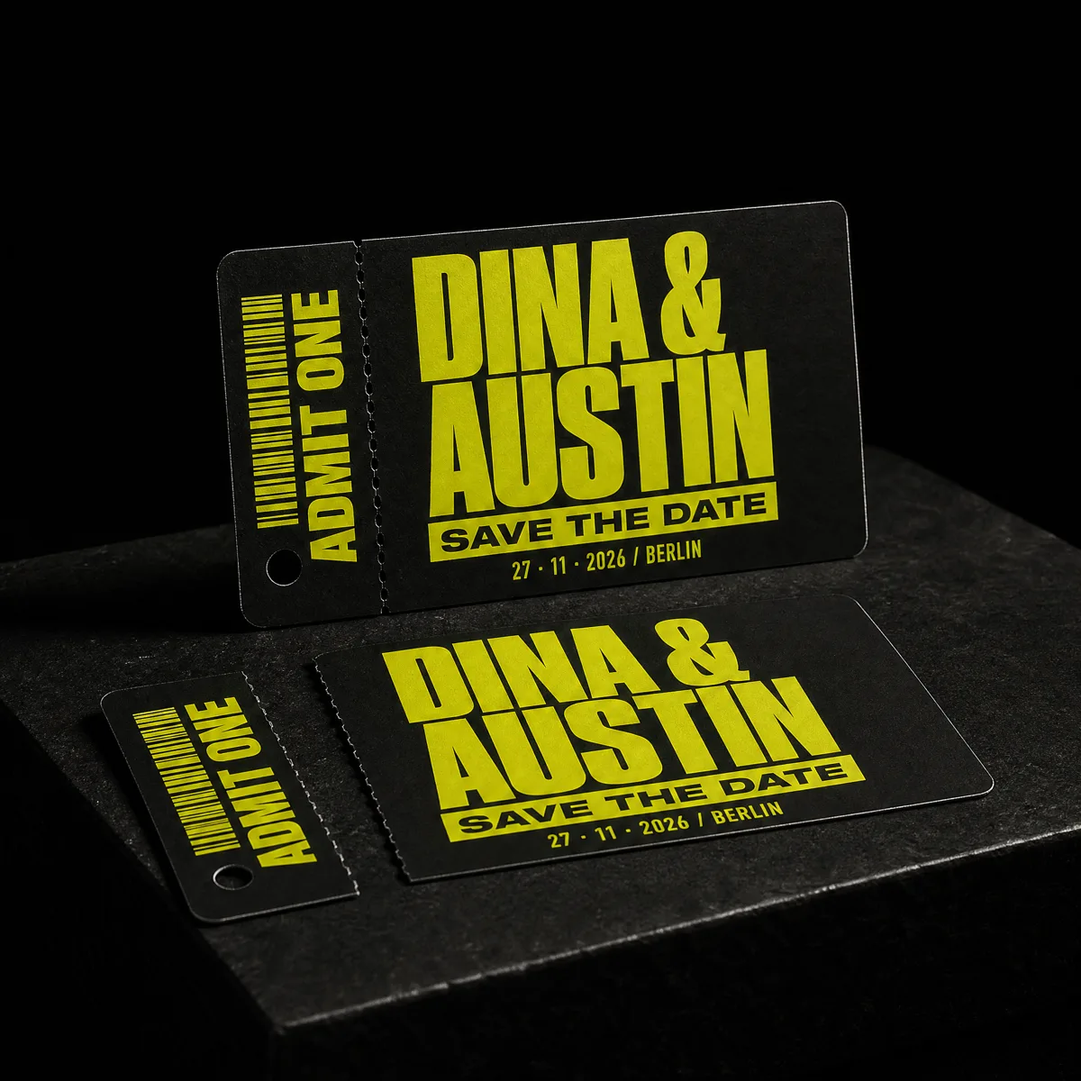 Rock-and-roll wedding save-the-date styled as a concert ticket stub, matte black PVC with fluorescent chartreuse, by Print Peppermint