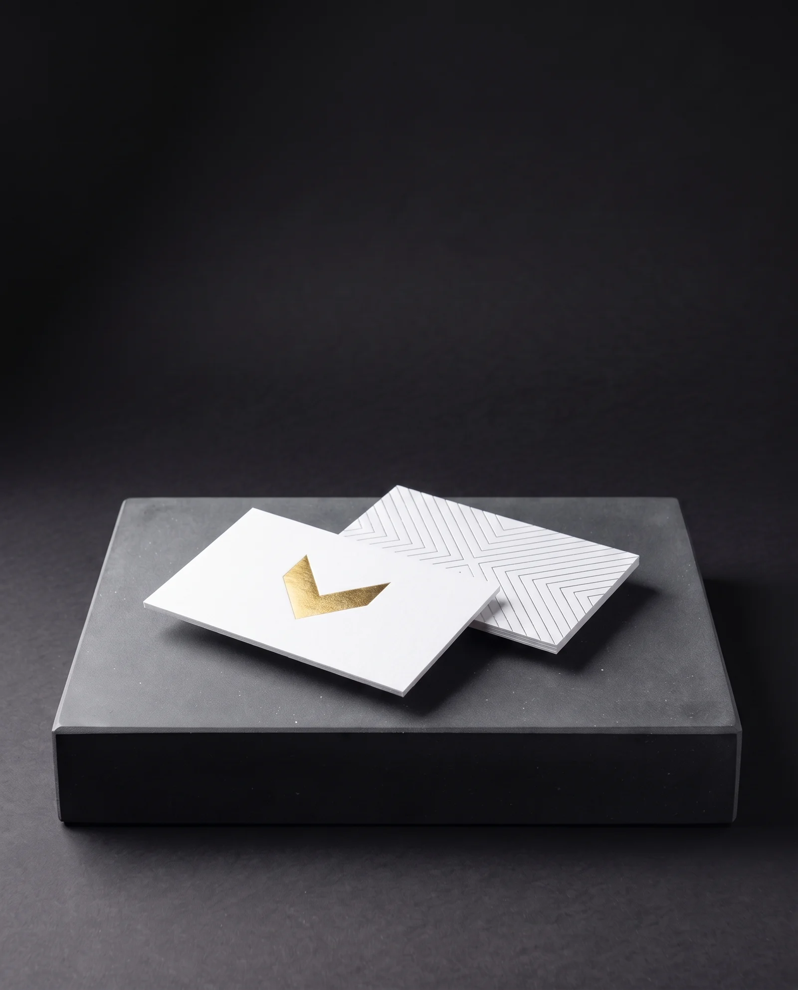 A card's gold-foiled front and silver-foiled back shown side by side.