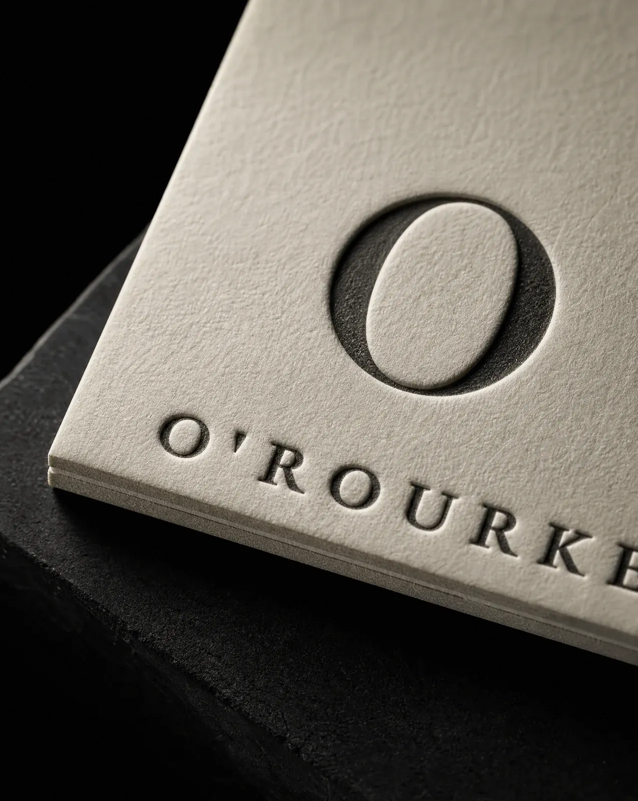 Close-up of the O'Rourke business card: one ink letterpressed deep into duplexed cotton