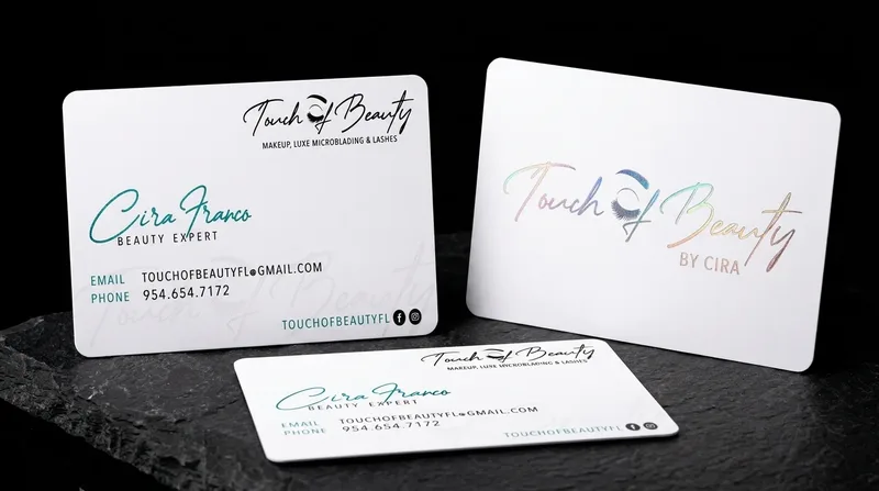 Makeup artist business card with a script wordmark in holographic foil on white and rounded corners