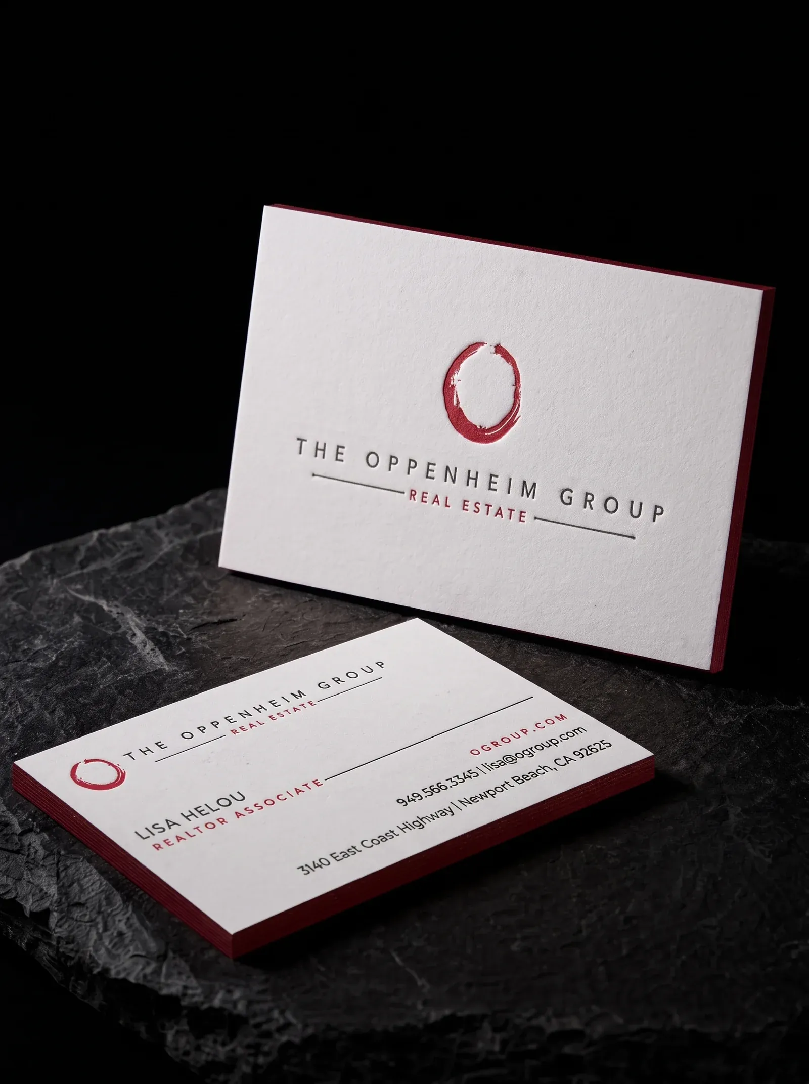 The Oppenheim Group business cards: two-colour letterpress on bright white cotton with a red painted edge, on black stone