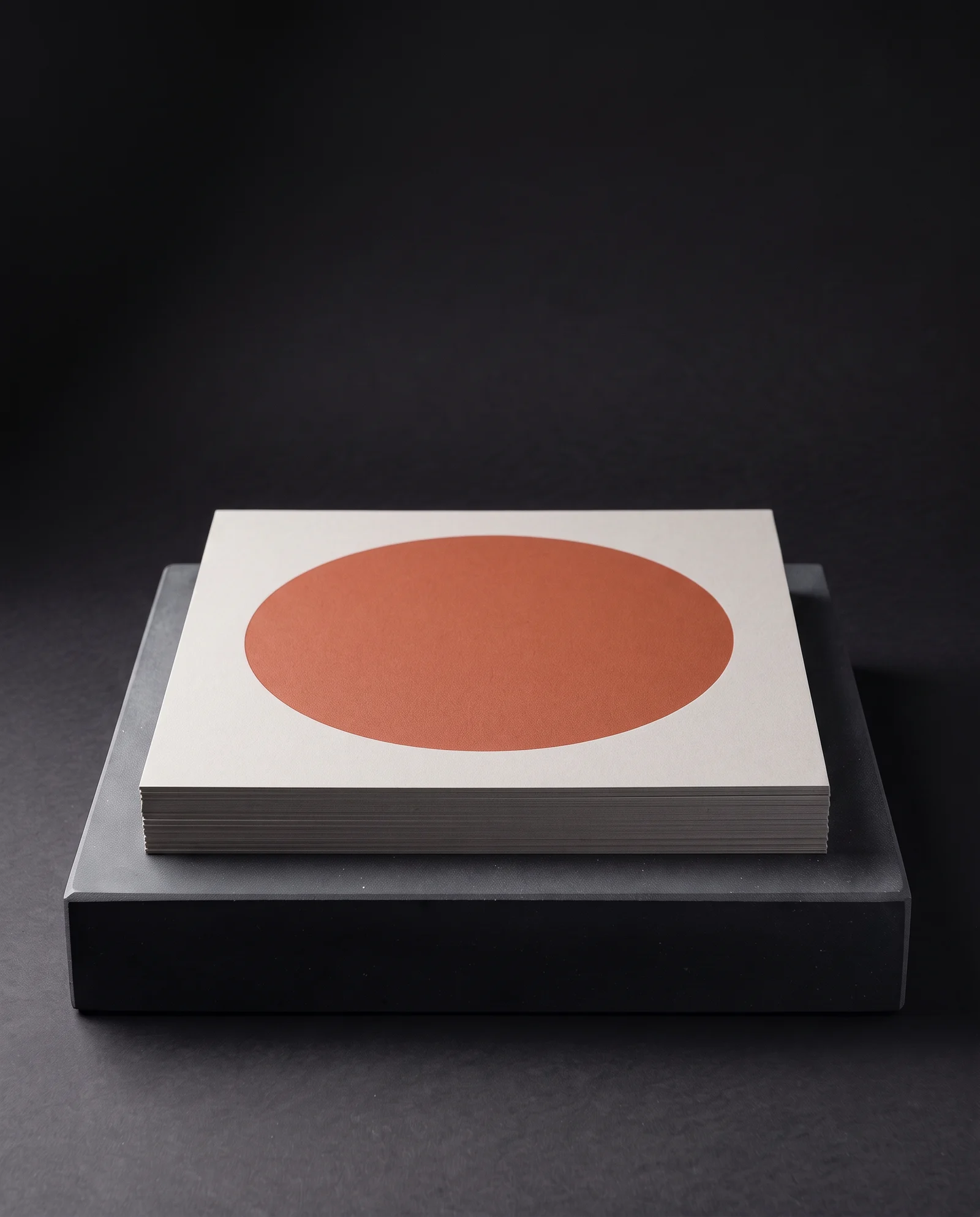 Terracotta print under pale grey soft-touch laminate.