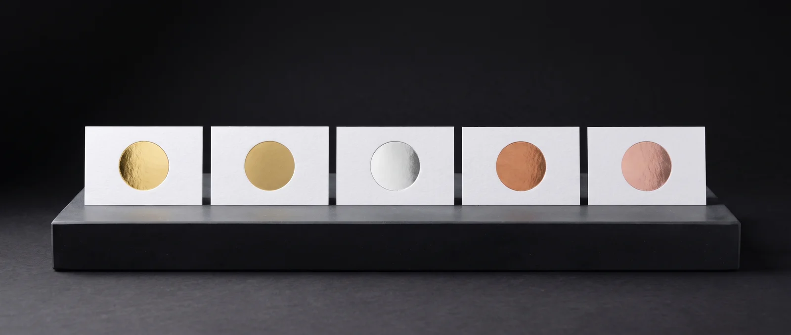 Five cotton cards with solid discs in mirror gold, matte gold, silver, copper and rose gold foil.