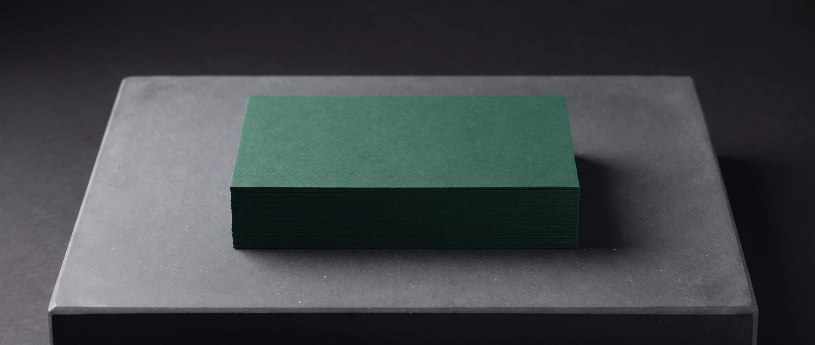 Deep green soft-touch laminated cards, evenly matte.