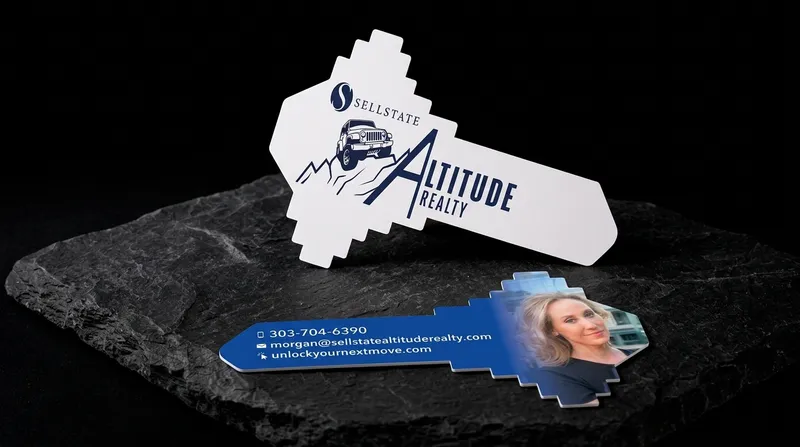 House-key-shaped die-cut realtor business card with a white bow and blue reverse