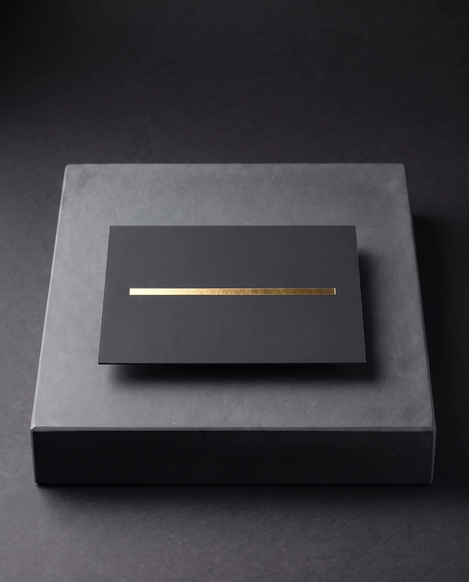 Mirror gold foil on black soft-touch laminate.