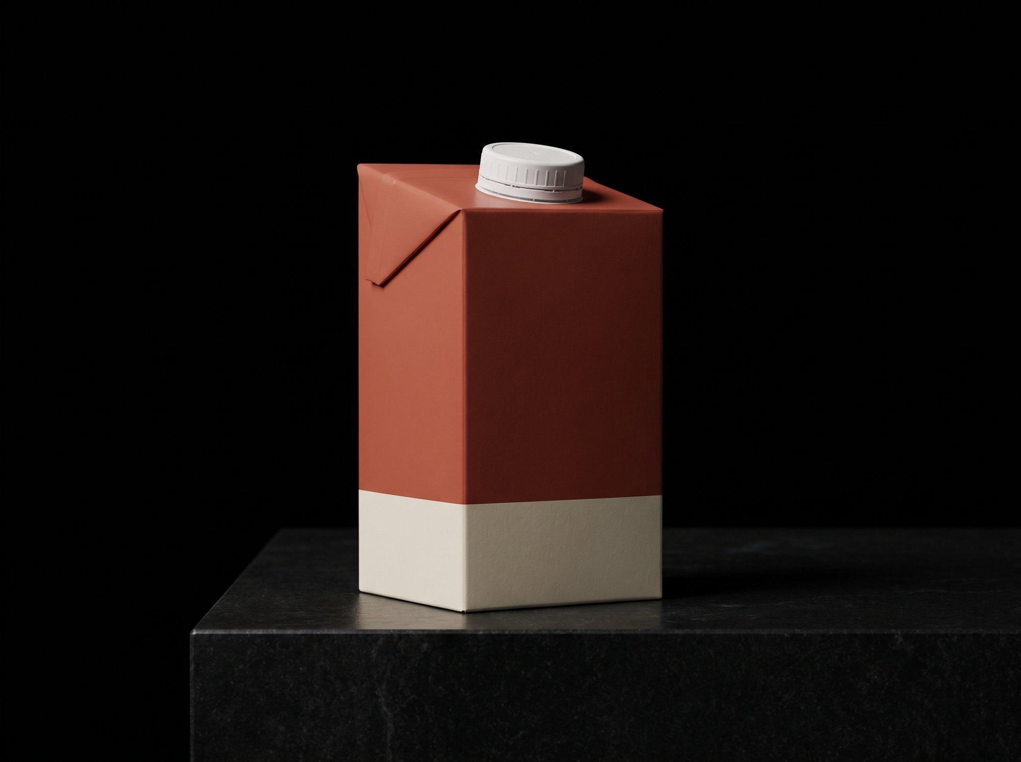 A slim terracotta aseptic carton with a sloped top panel and a white screw cap.
