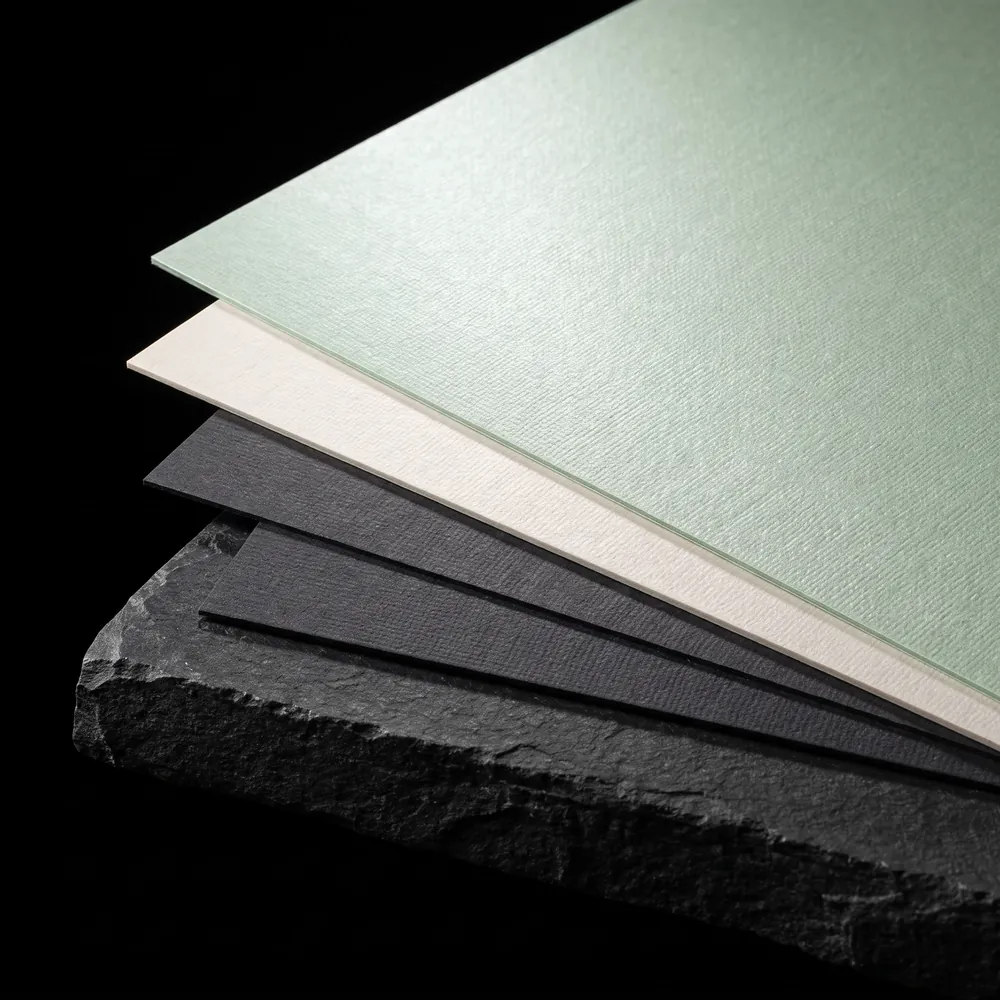 Fedrigoni pearlescent embossed papers in jade, ivory and charcoal