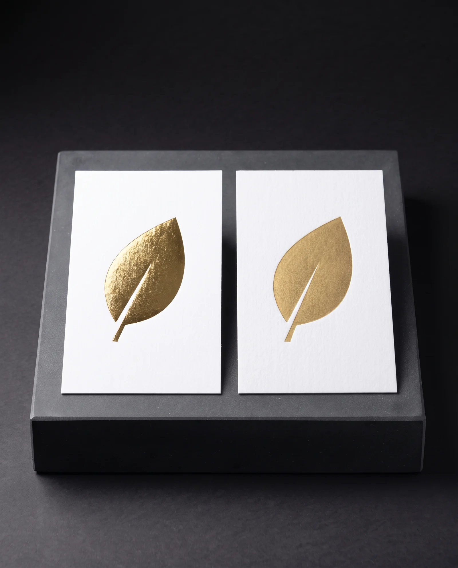 Mirror gold and matte gold foil side by side on white cotton.