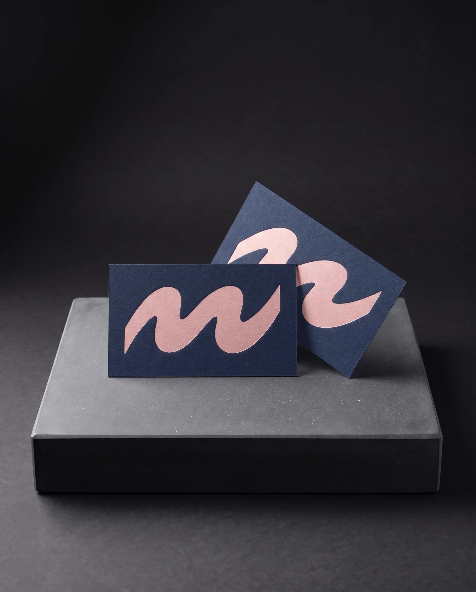 Opaque matte blush-pink pigment foil on navy colour-through card.