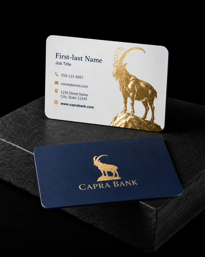 Bank business card with a gold foil ibex on soft touch, a navy painted edge and rounded corners