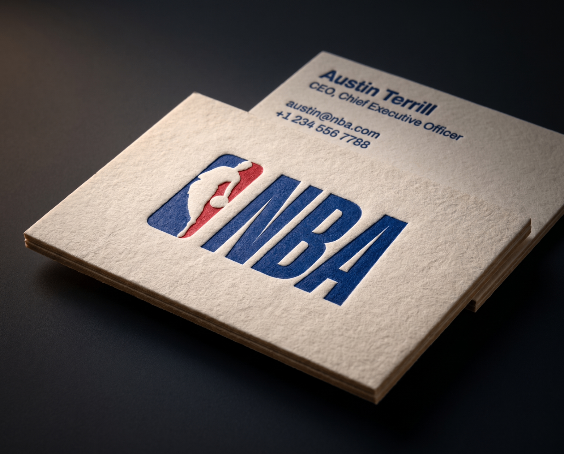 Letterpress business card with deep blue NBA logo on cotton stock
