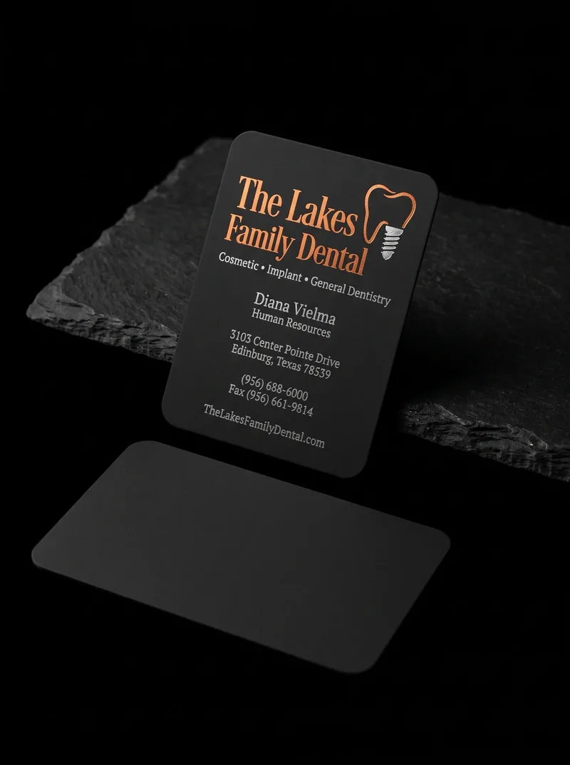 Black rounded-corner dental business card with orange and silver foil