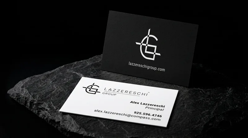 Black business card with a white foil crosshair monogram
