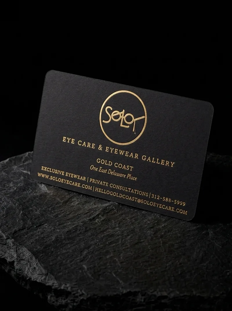 Black rounded-corner business card with gold foil lettering