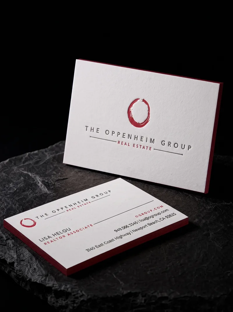White cotton letterpress business card with a thin red painted edge