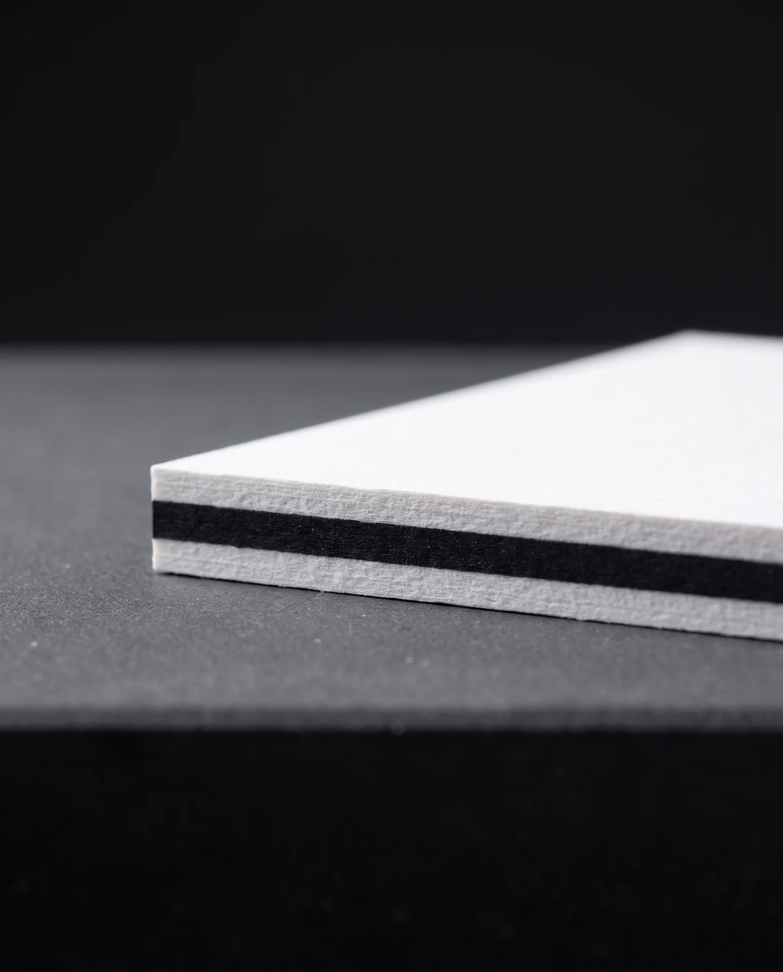 Macro of a triplex edge, three plies perfectly aligned.