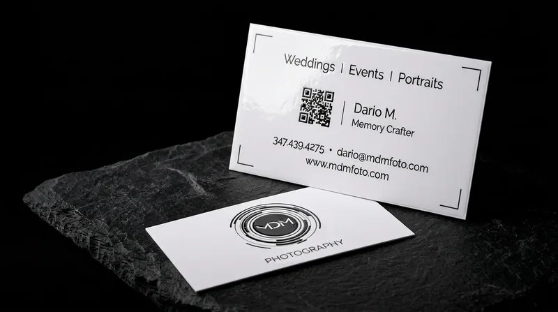 Photographer business card with a camera-lens mark whose centre is coated in raised high gloss