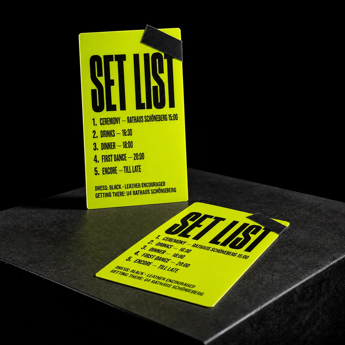 Wedding details card styled as a stage set list, fluorescent chartreuse PVC with black print, by Print Peppermint