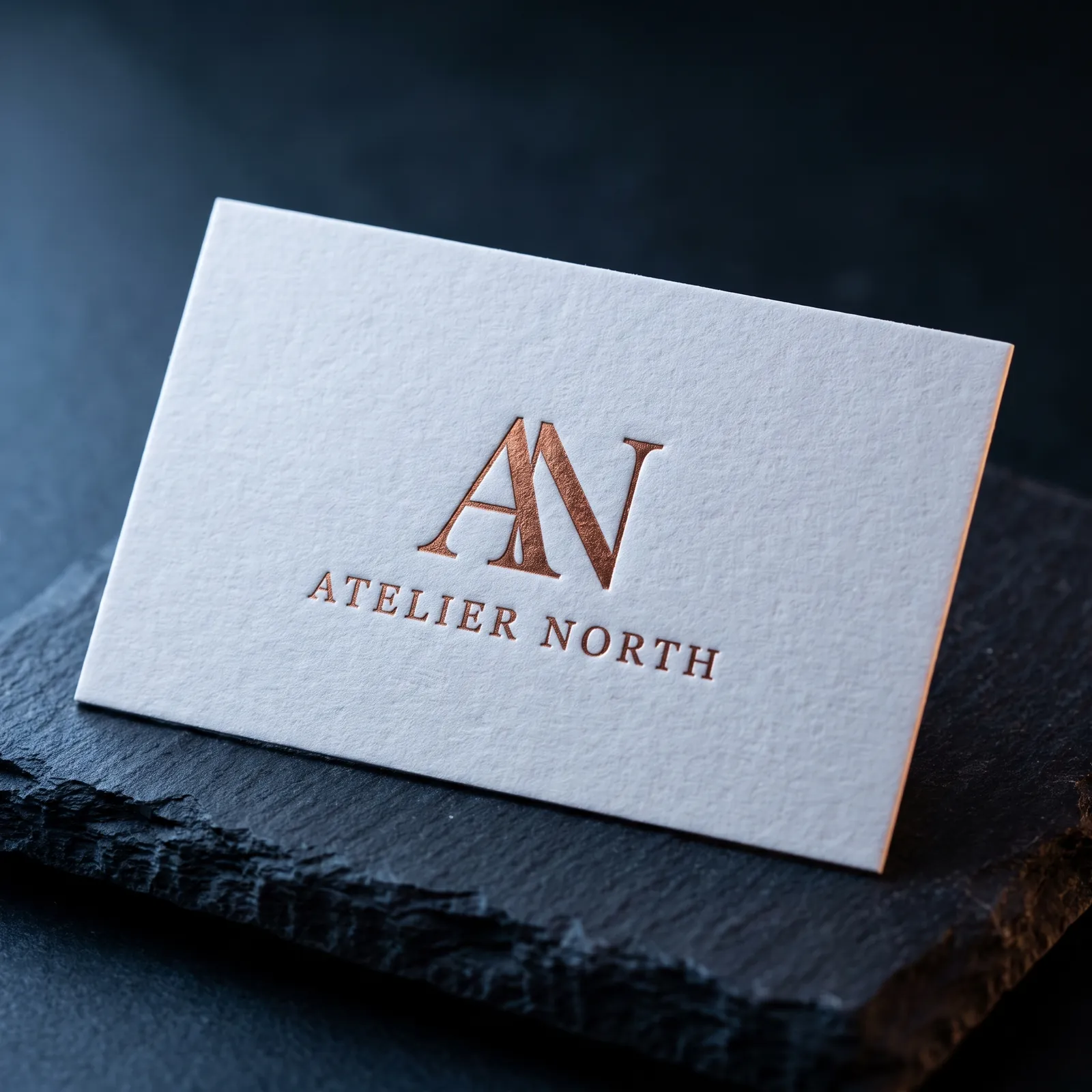Copper foil serif monogram business card on 32pt cotton, a Studio design exploration