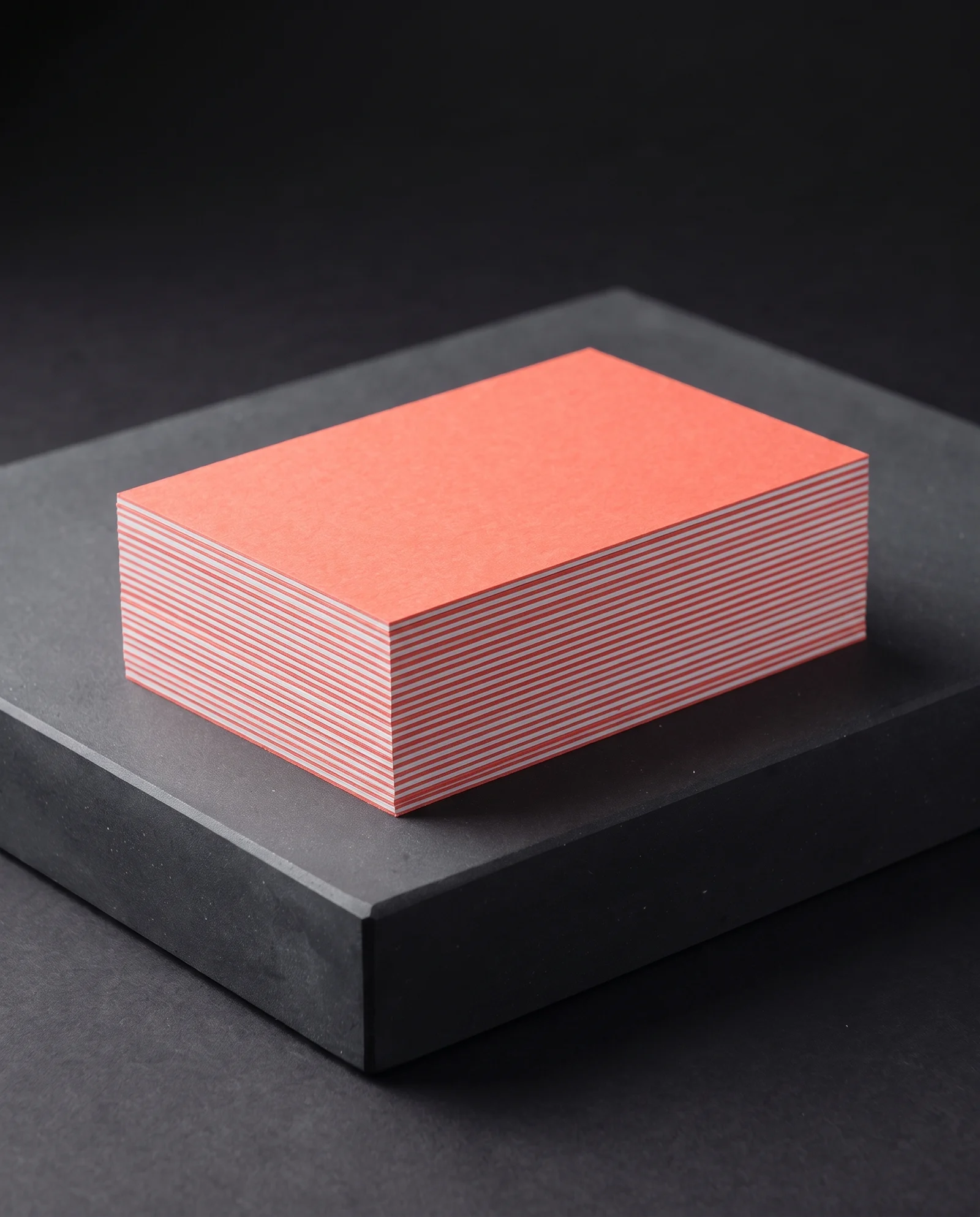 Coral and white duplex plies meeting at a crisp edge seam.