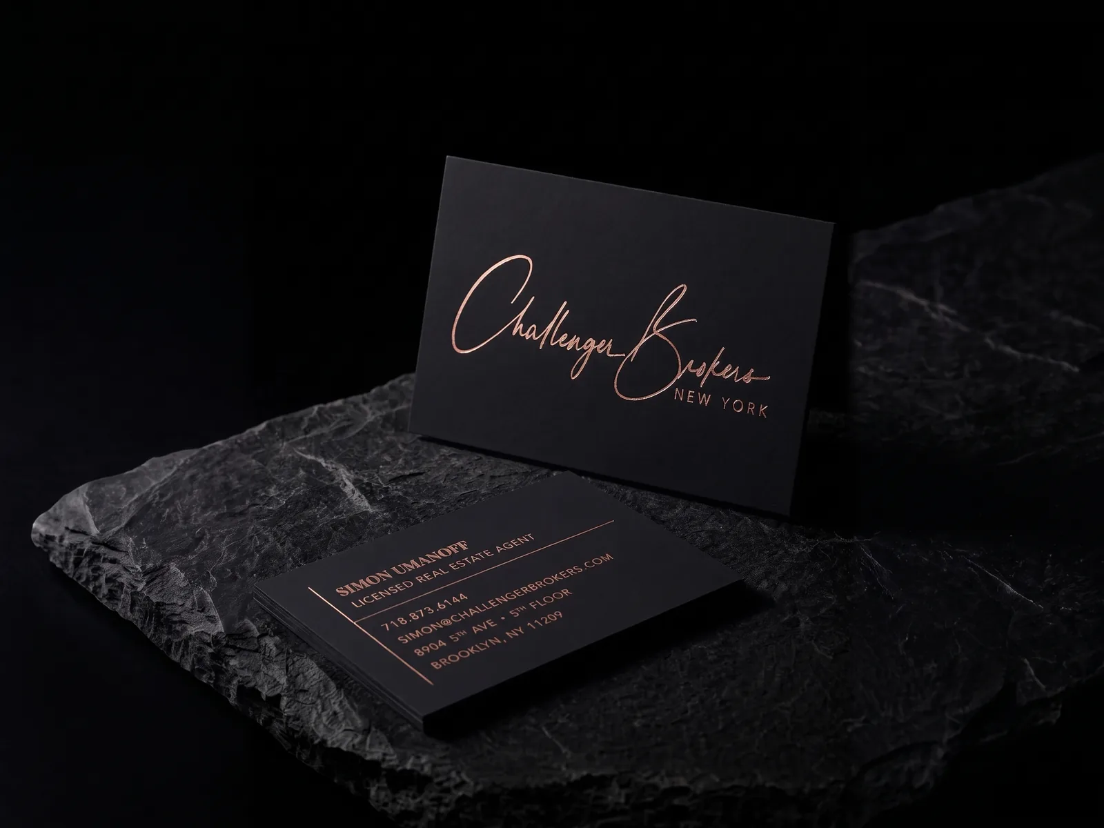 Challenger Brokers business card: rose gold foil on black