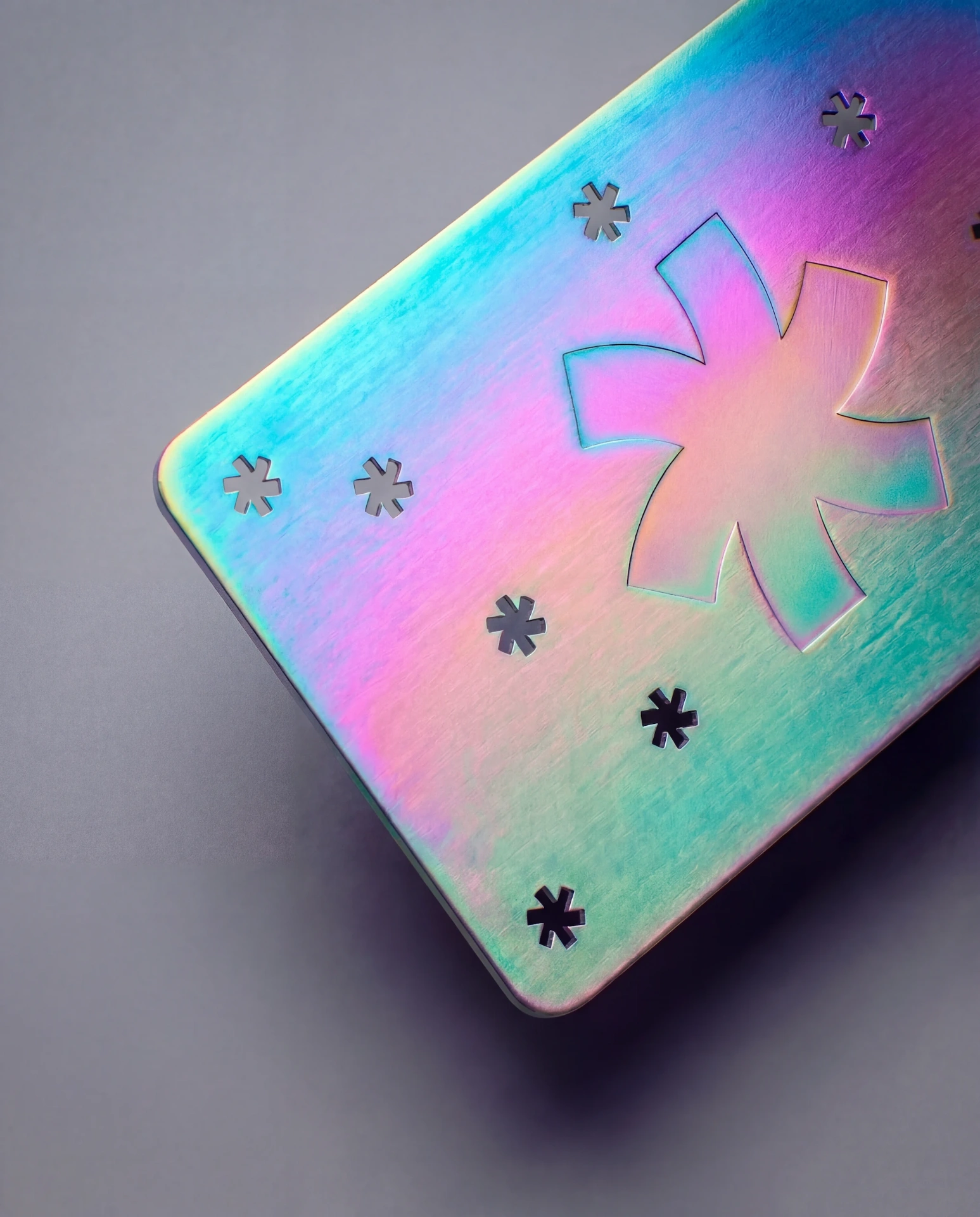 Iridescent metal business card with prismatic color-shifting PVD coating