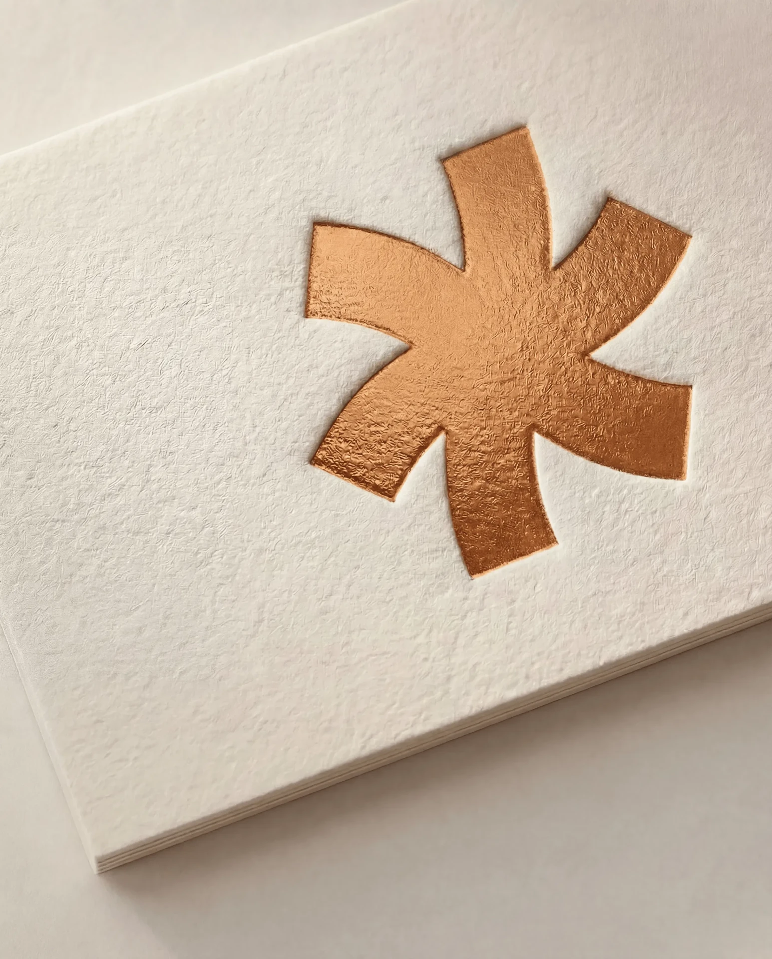 Copper foil stamped into white cotton card