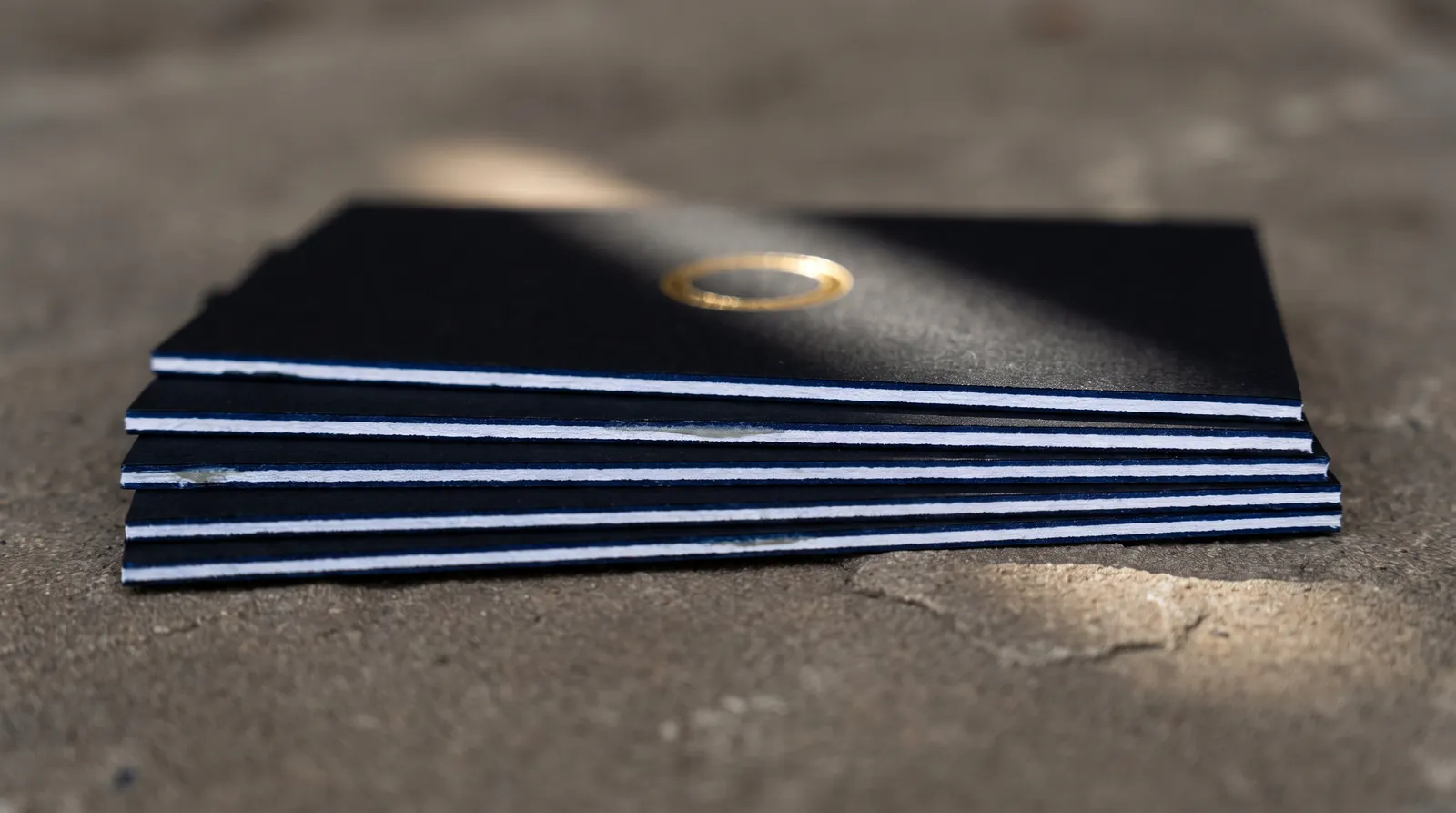 The order finishes run in, the tolerances that stack up between passes, and the house compatibility rules for building foil, letterpress, emboss, spot UV, die cuts and painted edges into one piece.