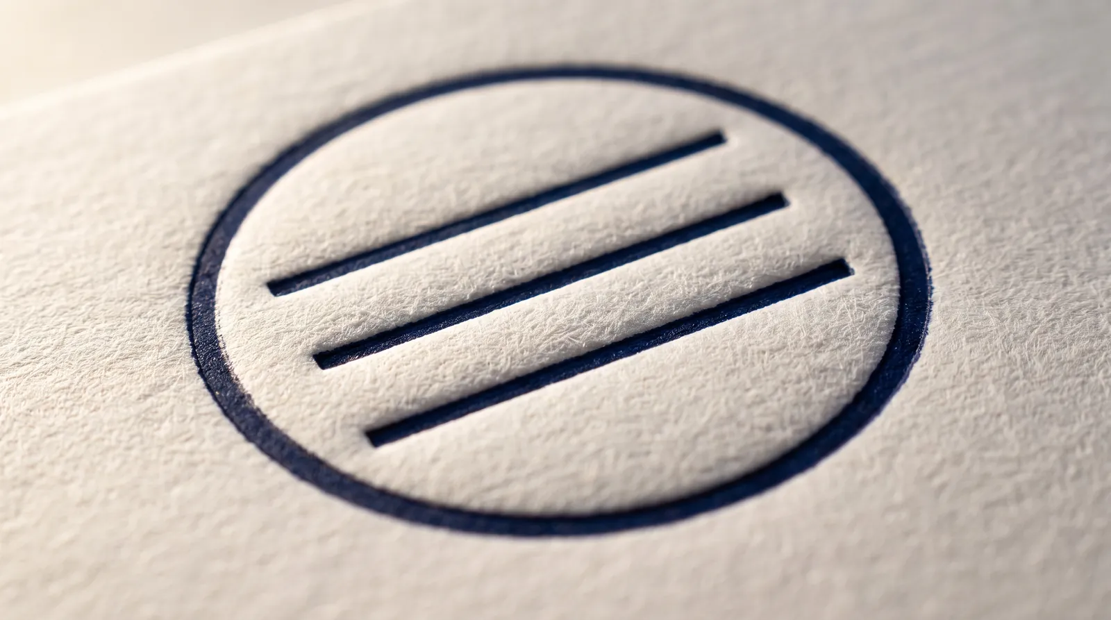 One plate per color, solid Pantone U inks, lines built to survive the squash, and the depth your paper can take. The letterpress file rules, with the physics behind each one.