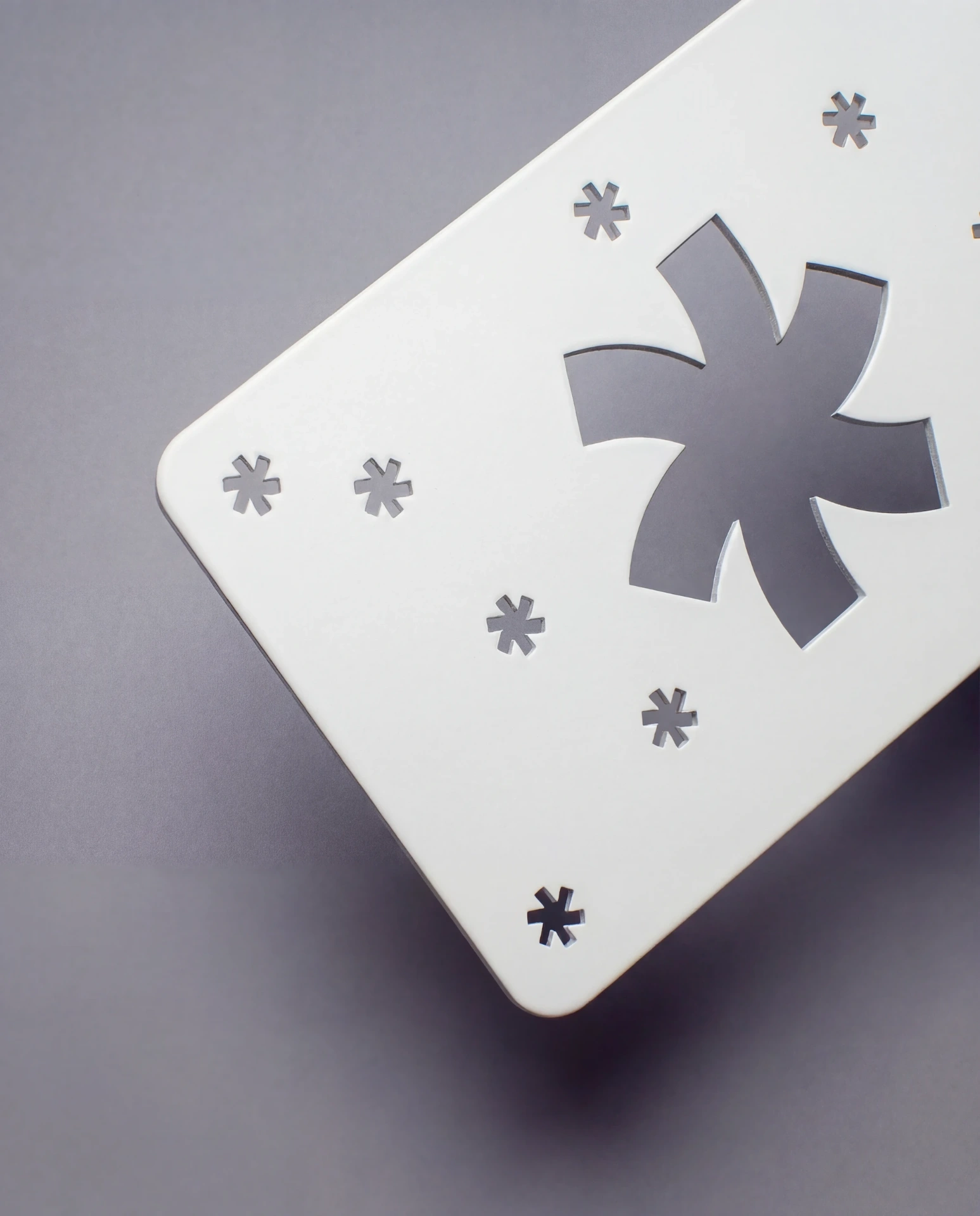 White metal business card with clean ceramic-like PVD coating