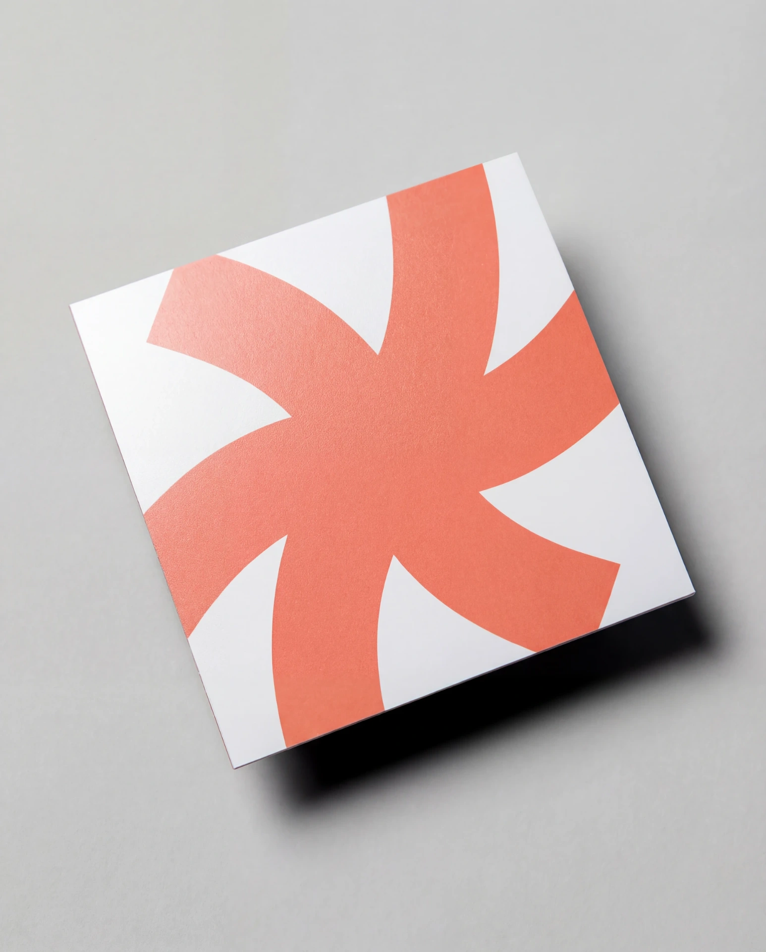Square 16pt matte business card on gray background