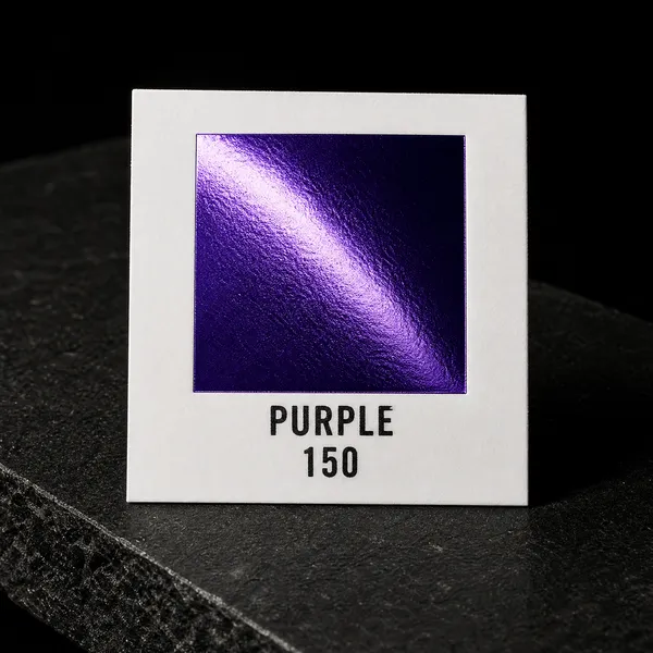 Purple 150 foil chip photographed on slate