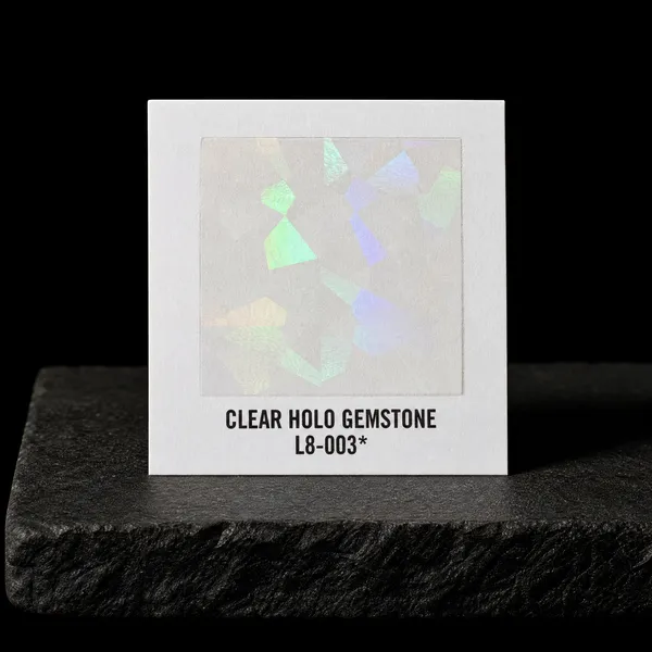 Clear Holo Gemstone L8-003 foil chip photographed on slate